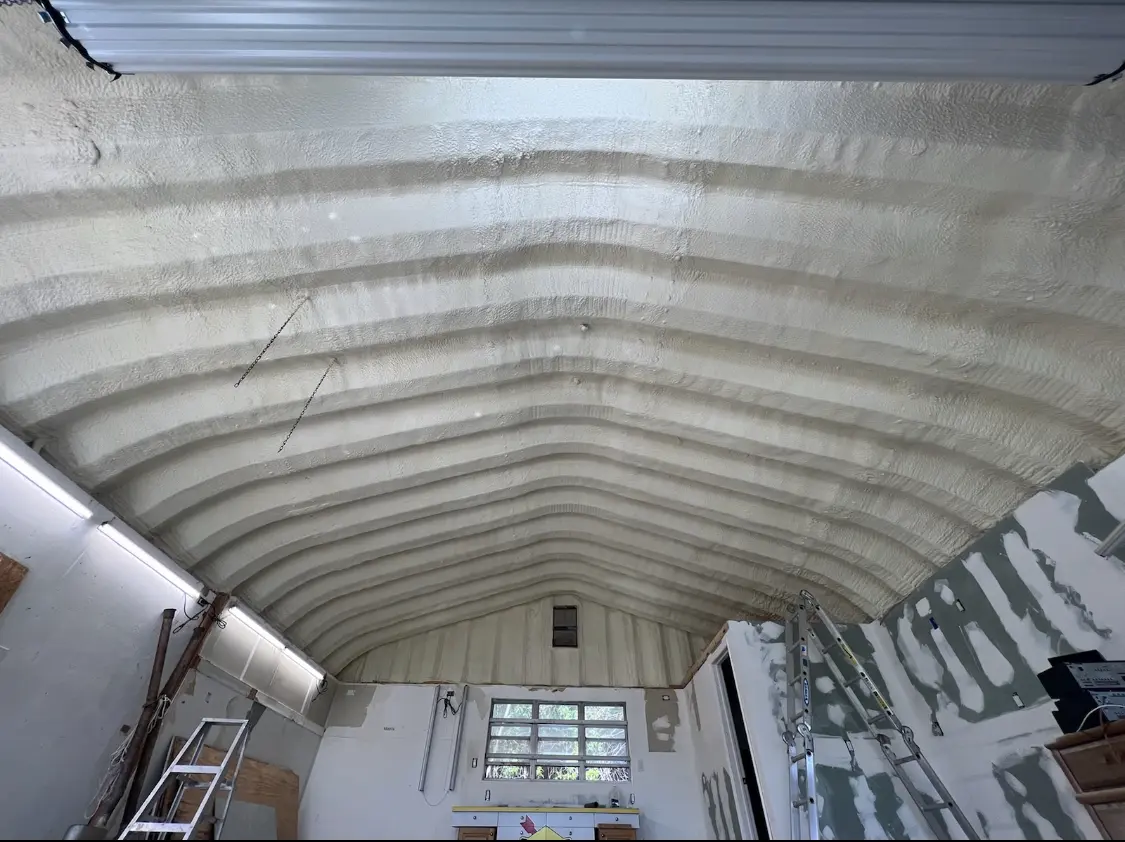 Spray polyurethane foam applied to the underside of a metal roof deck in Lincoln Village